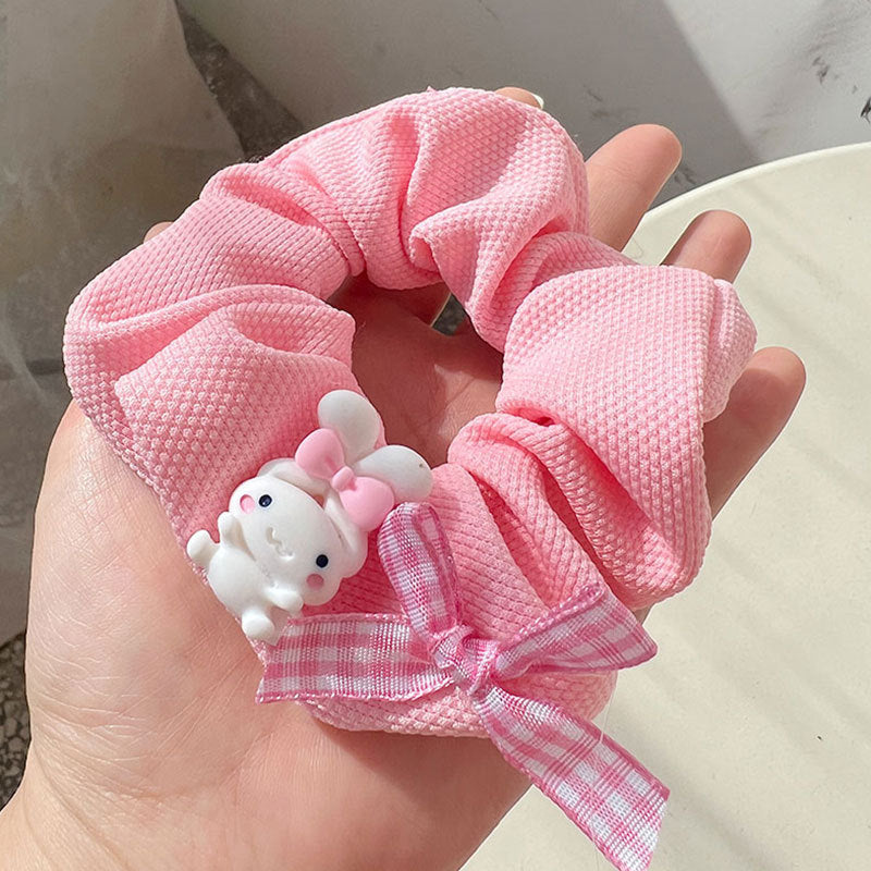 Knock On The Pink Hair Tie featuring a stylish pink and white design, perfect for securing hair in various styles.