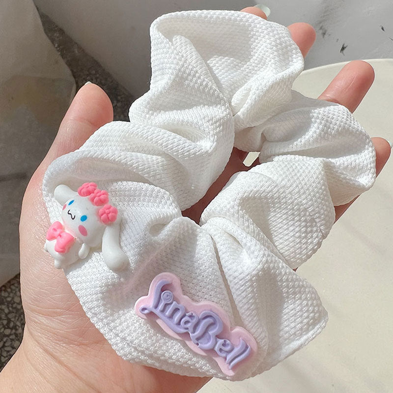 Knock On The Pink Hair Tie featuring a stylish pink and white design, perfect for securing hair in various styles.