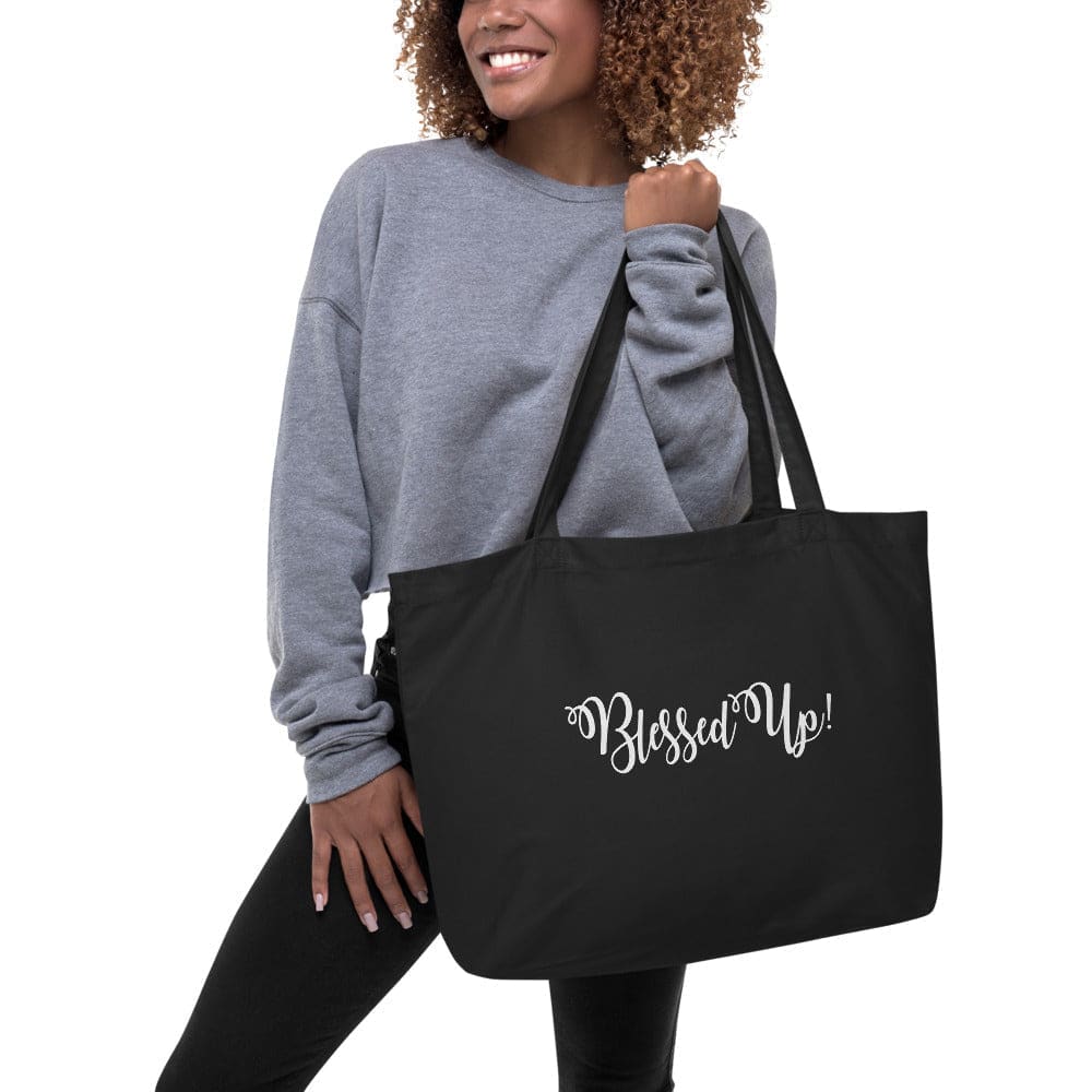 Large black tote bag featuring an inspirational 'Blessed Up' print, made from durable cotton twill with long dual straps.