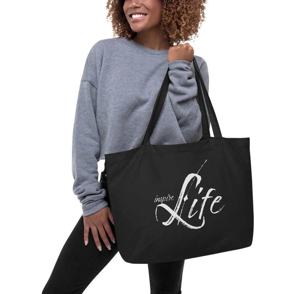 Large black tote bag made of durable cotton twill with inspirational print, featuring long dual straps and spacious open compartment.