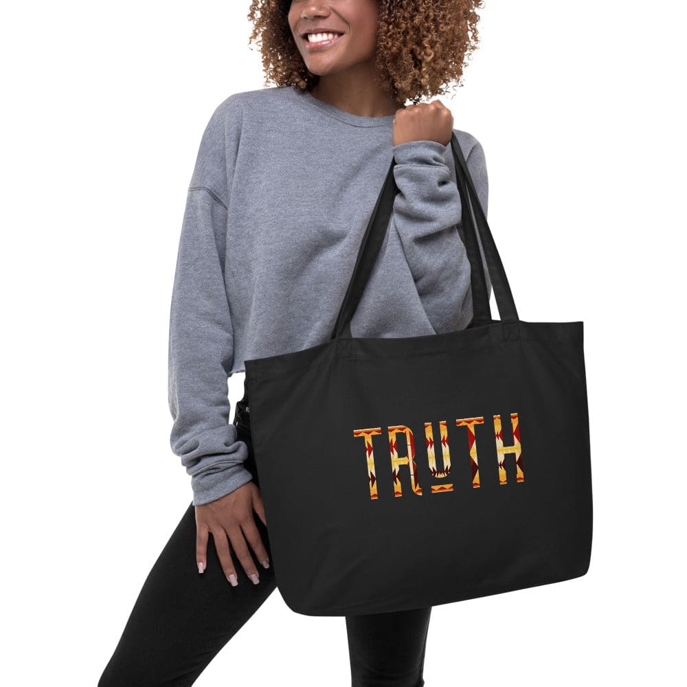 Large black tote bag featuring an inspirational print, made of durable cotton with dual straps for easy carrying.