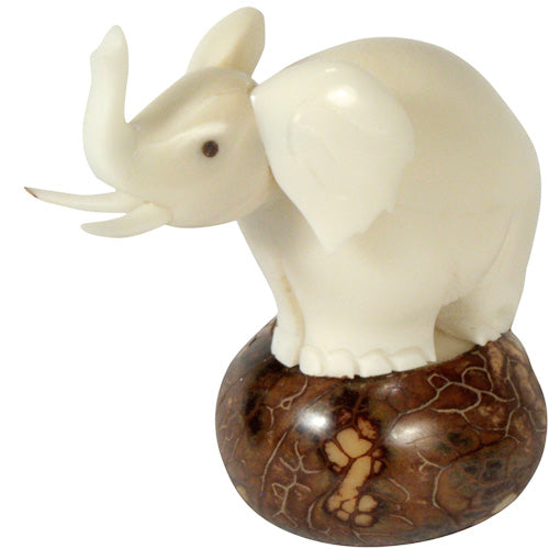 Hand-carved Large Elephant Figurine made from tagua nuts, showcasing intricate details and natural colors, symbolizing eco-friendliness and craftsmanship.