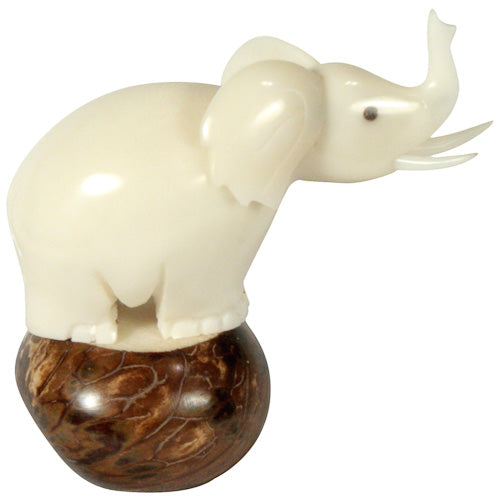 Hand-carved Large Elephant Figurine made from tagua nuts, showcasing intricate details and natural colors, symbolizing eco-friendliness and craftsmanship.