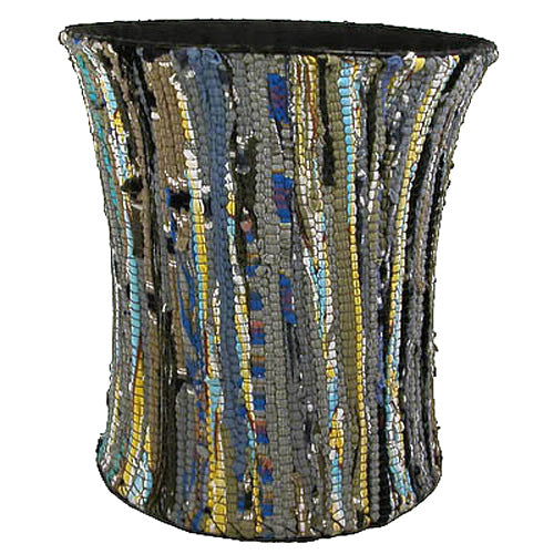 A large, colorful wastebasket made from recycled cloth scraps, showcasing unique patterns and vibrant colors, perfect for eco-friendly waste separation.