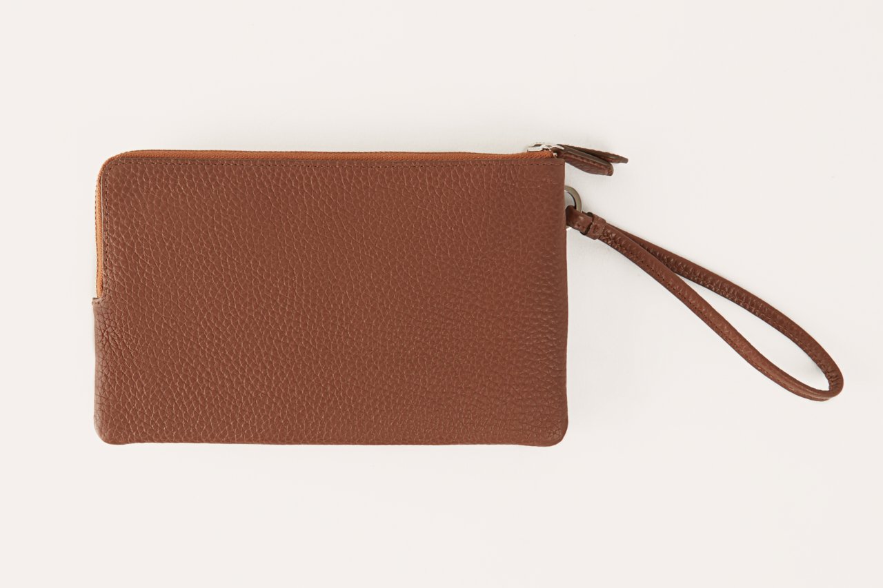 Large Wristlet made from genuine pebble leather with double zipper compartments, showcasing card slots and sleeve pockets.