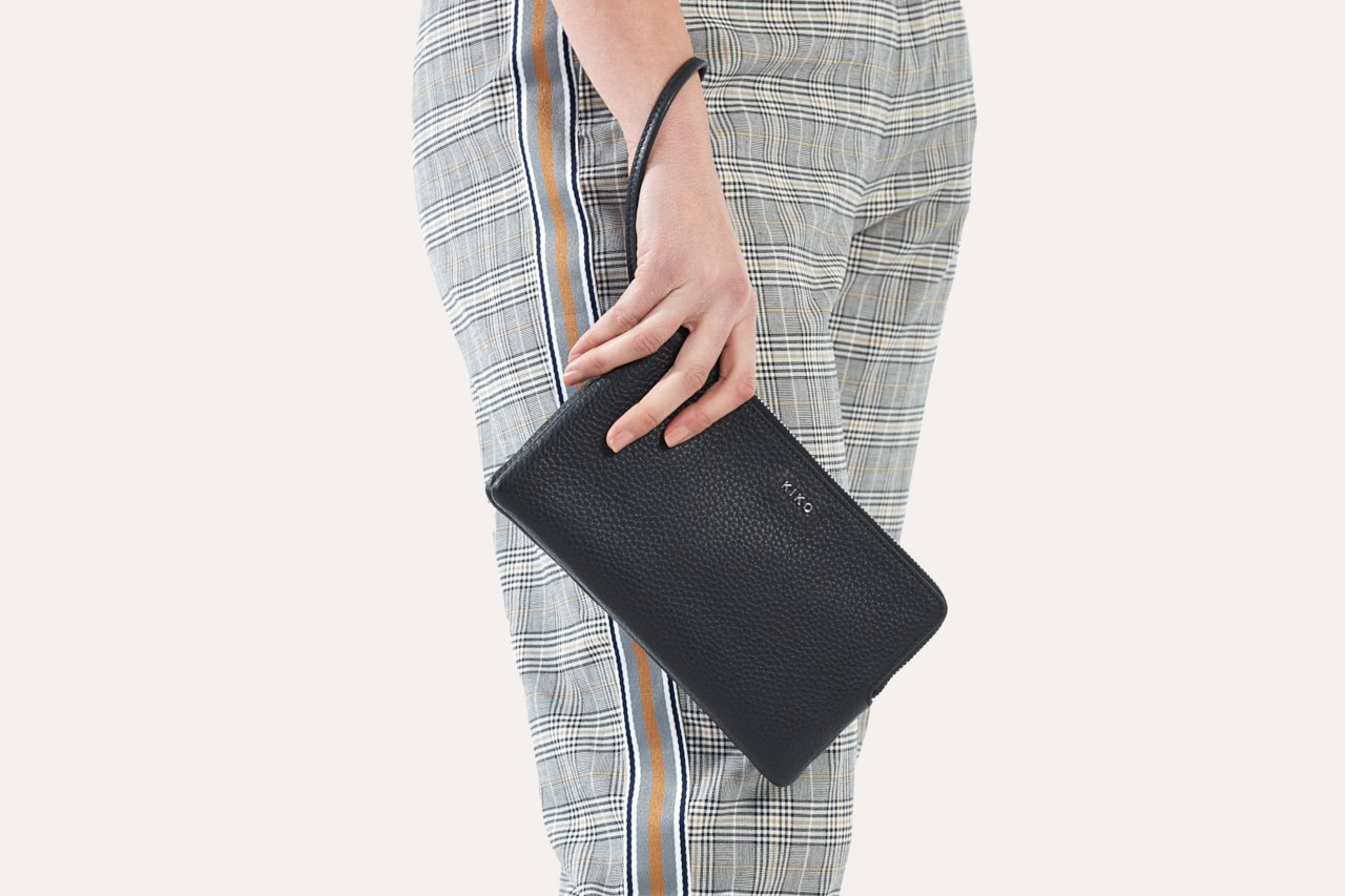 Large Wristlet made from genuine pebble leather with double zipper compartments, showcasing card slots and sleeve pockets.