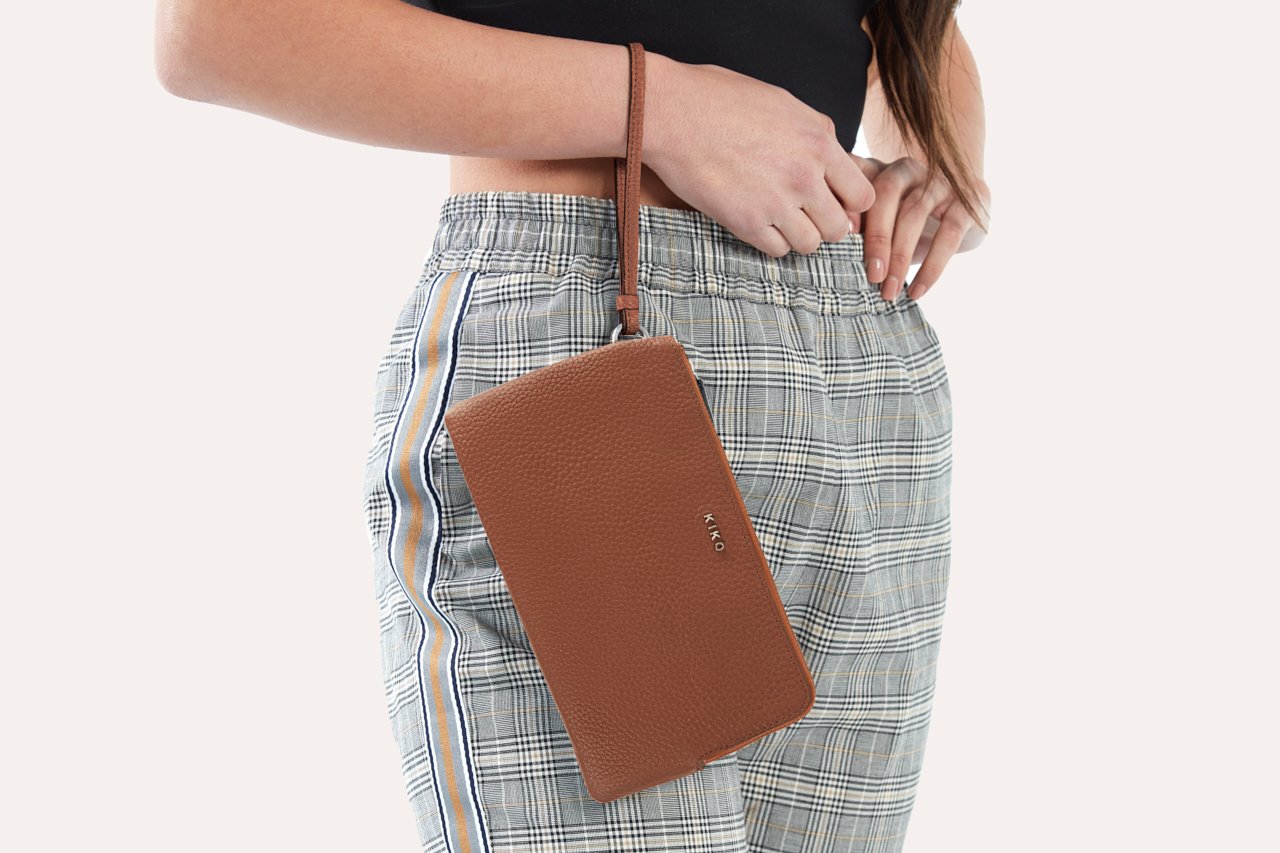 Large Wristlet made from genuine pebble leather with double zipper compartments, showcasing card slots and sleeve pockets.