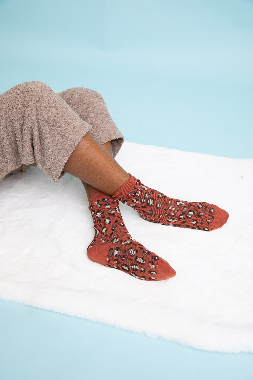 Cozy Leopard Knit Socks featuring a stylish leopard print design, perfect for lounging or casual wear.