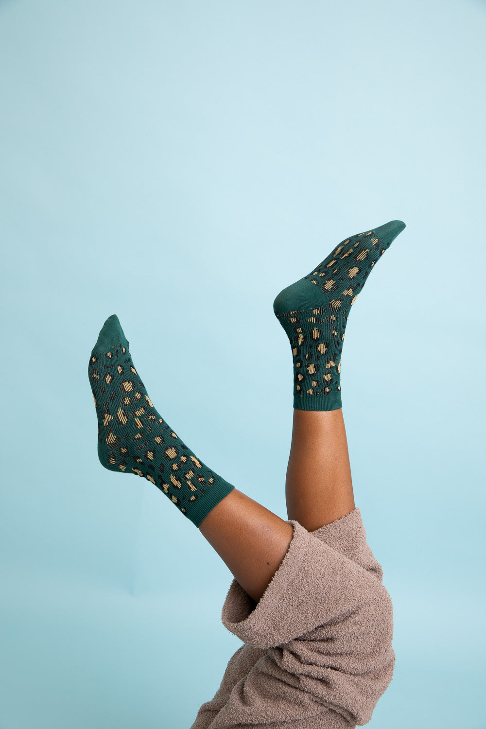 Cozy Leopard Knit Socks featuring a stylish leopard print design, perfect for lounging or casual wear.