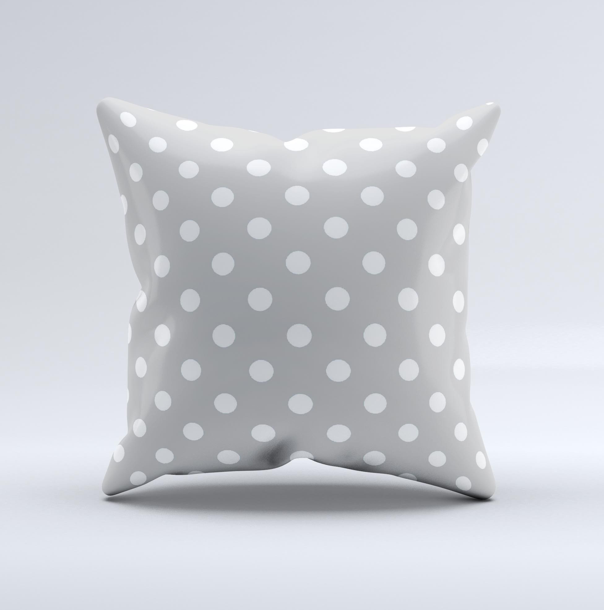 Light gray decorative throw pillow with white polka dots, handcrafted in Virginia, showcasing a unique design and high-quality fabric.