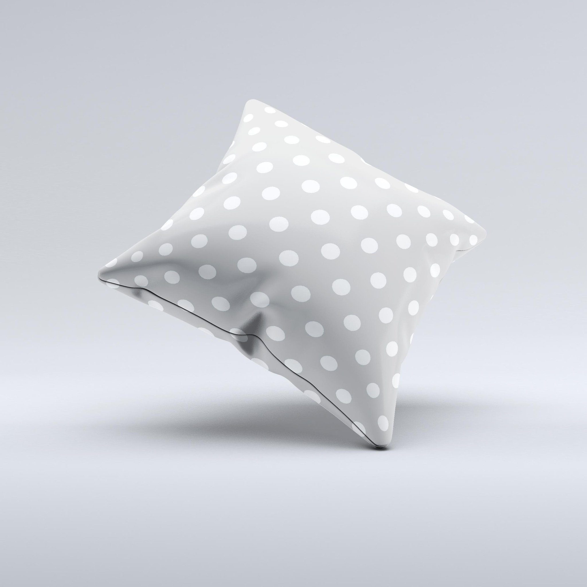 Light gray decorative throw pillow with white polka dots, handcrafted in Virginia, showcasing a unique design and high-quality fabric.