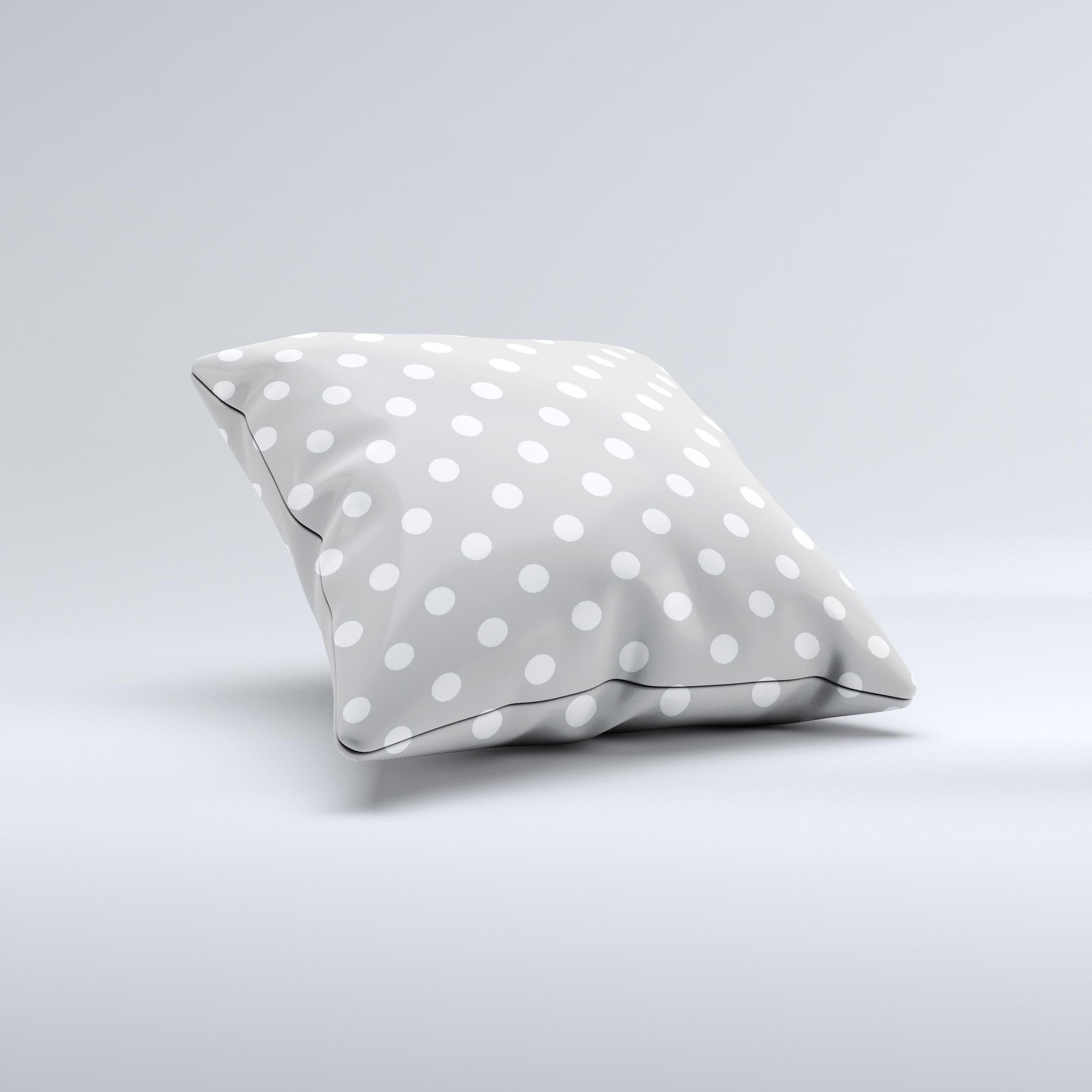 Light gray decorative throw pillow with white polka dots, handcrafted in Virginia, showcasing a unique design and high-quality fabric.