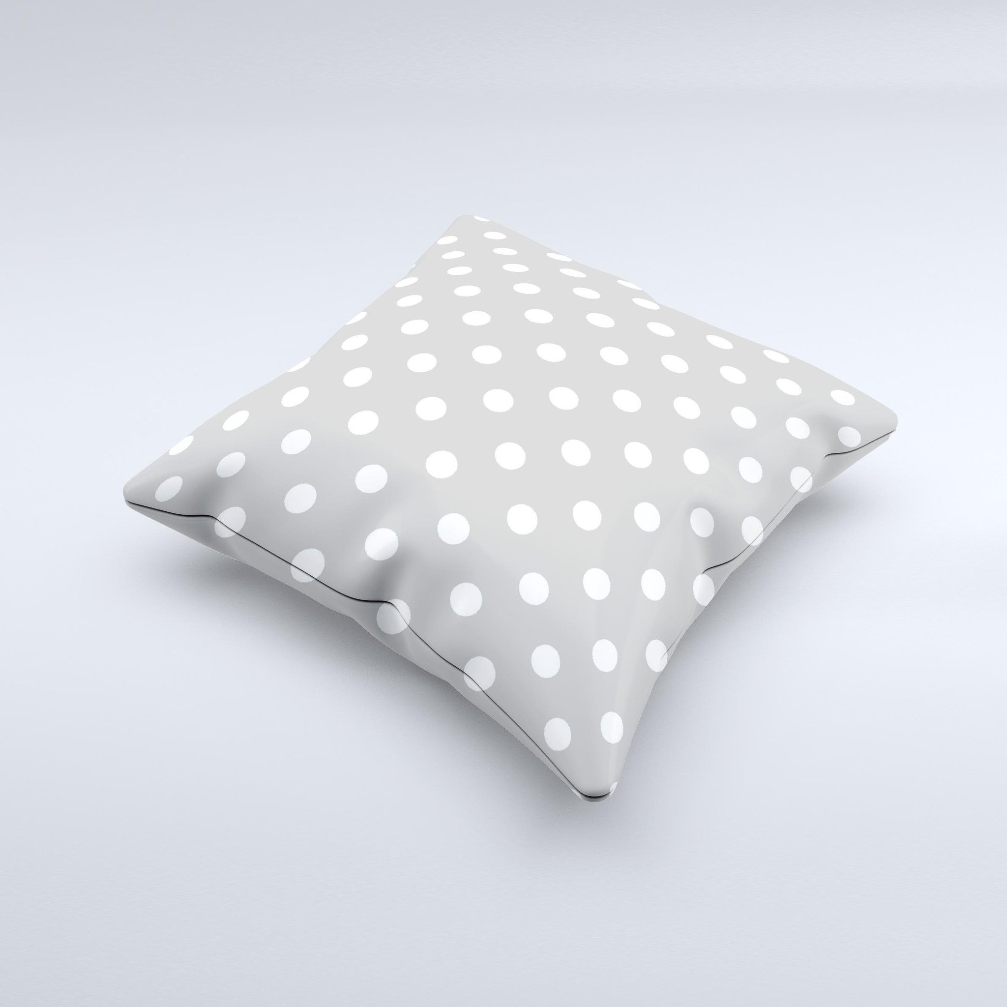 Light gray decorative throw pillow with white polka dots, handcrafted in Virginia, showcasing a unique design and high-quality fabric.