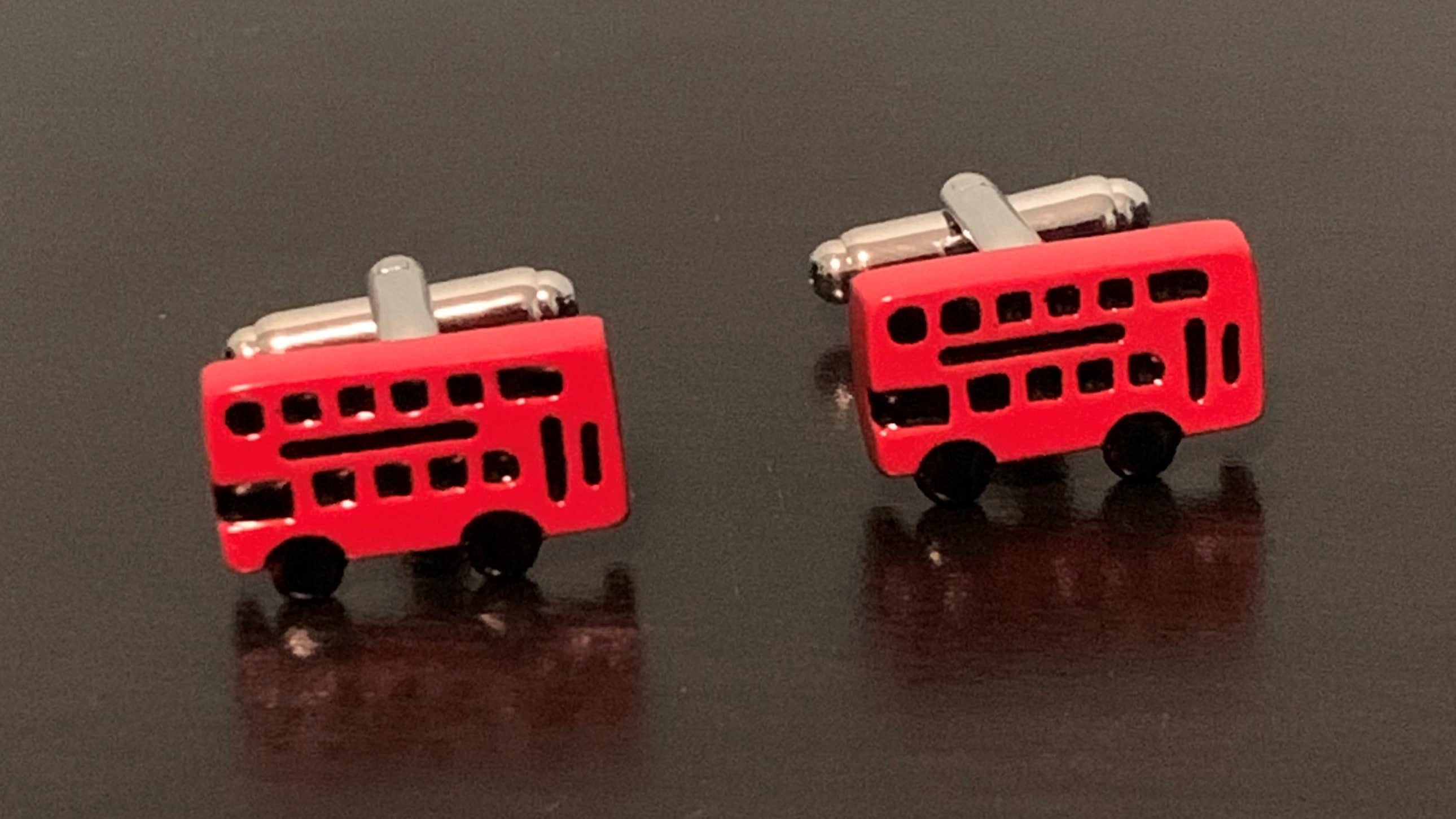 Stylish London Calling Cufflinks featuring a double decker bus design, perfect for gentlemen.