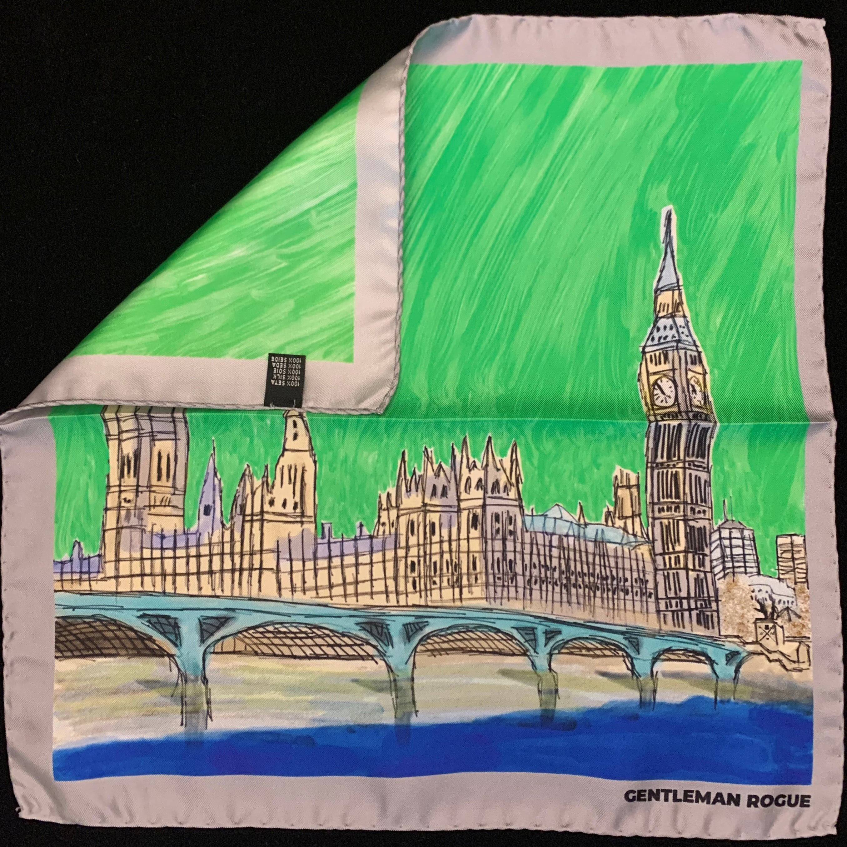 Elegant silver pocket square featuring a hand sketched design of the Palace of Westminster with a silver border.