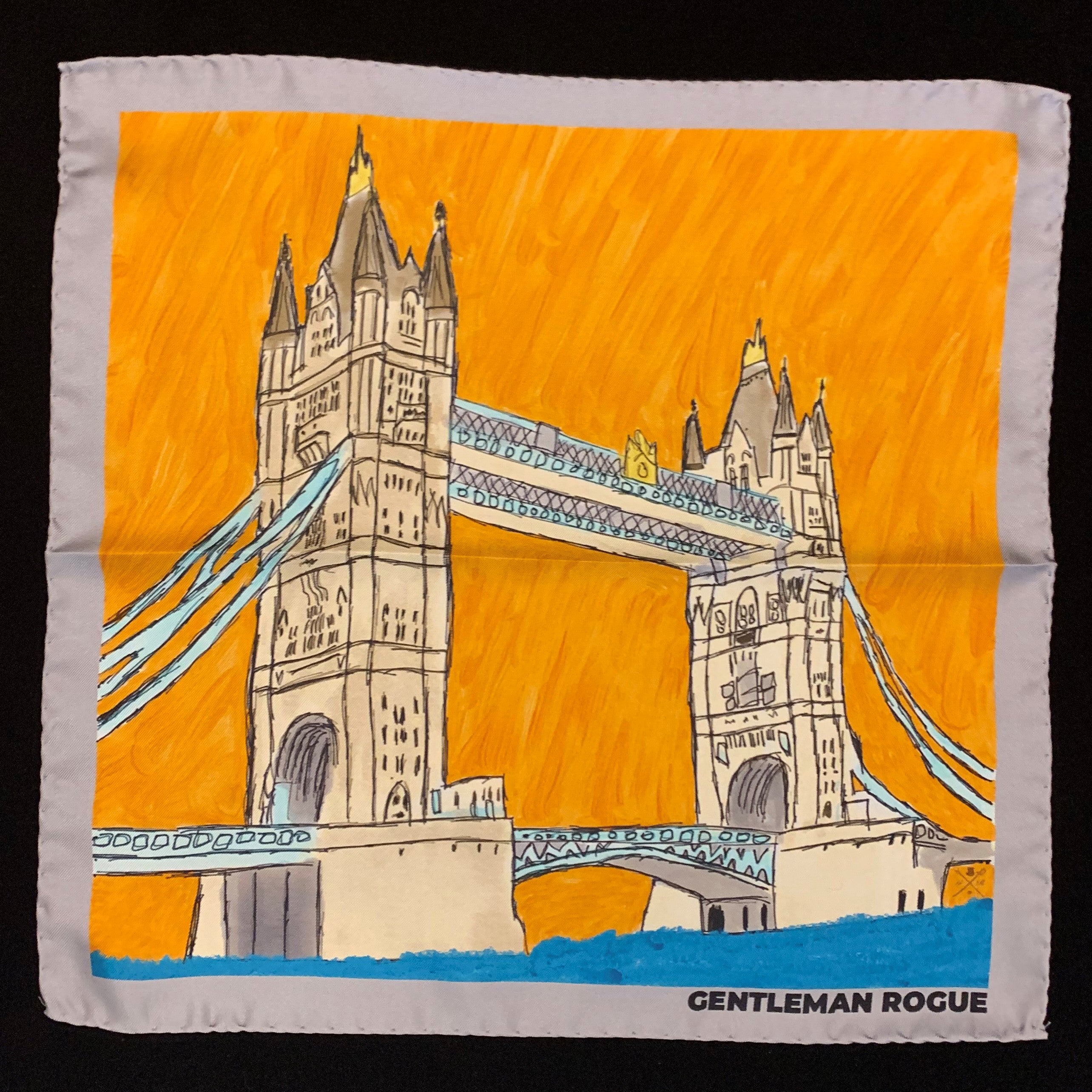 London Tower Bridge Silver Pocket Square featuring hand sketched design in burnt orange and sandstone with a silver border.