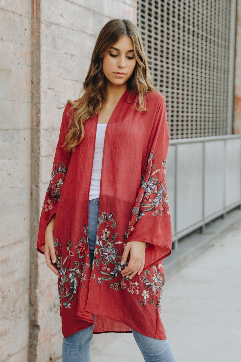 A stylish Long Floral Kimono Cardigan featuring a vibrant floral print, perfect for warm weather outings.