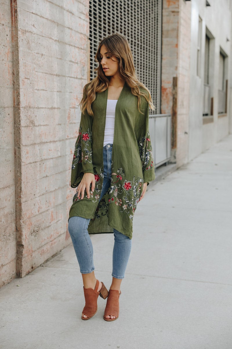 A stylish Long Floral Kimono Cardigan featuring a vibrant floral print, perfect for warm weather outings.