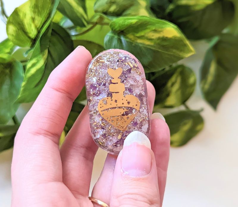 Love Potion Orgonite made of rose quartz and amethyst, featuring a unique design with brass and copper elements.