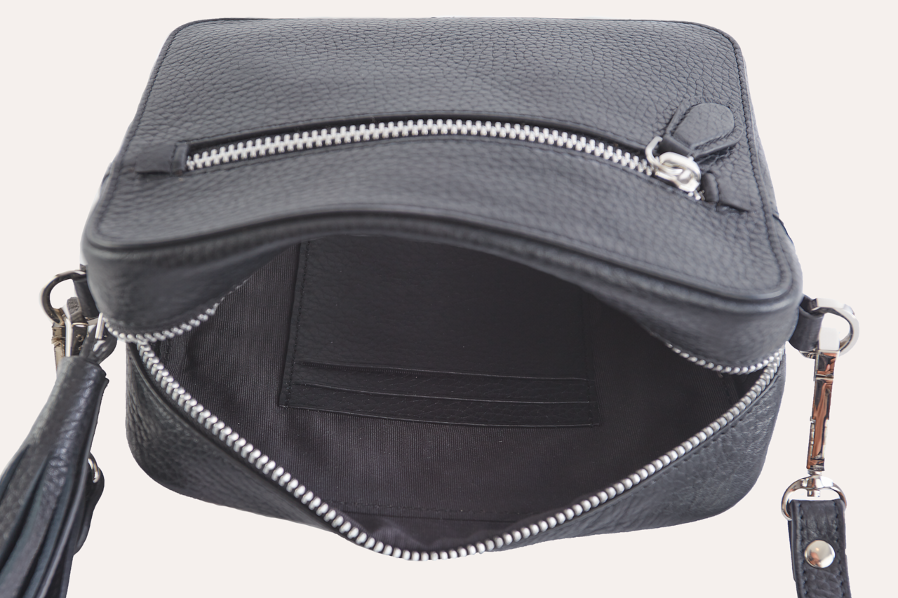 Loveable Crossbody bag made from genuine pebble leather, featuring an adjustable strap and internal card slots.