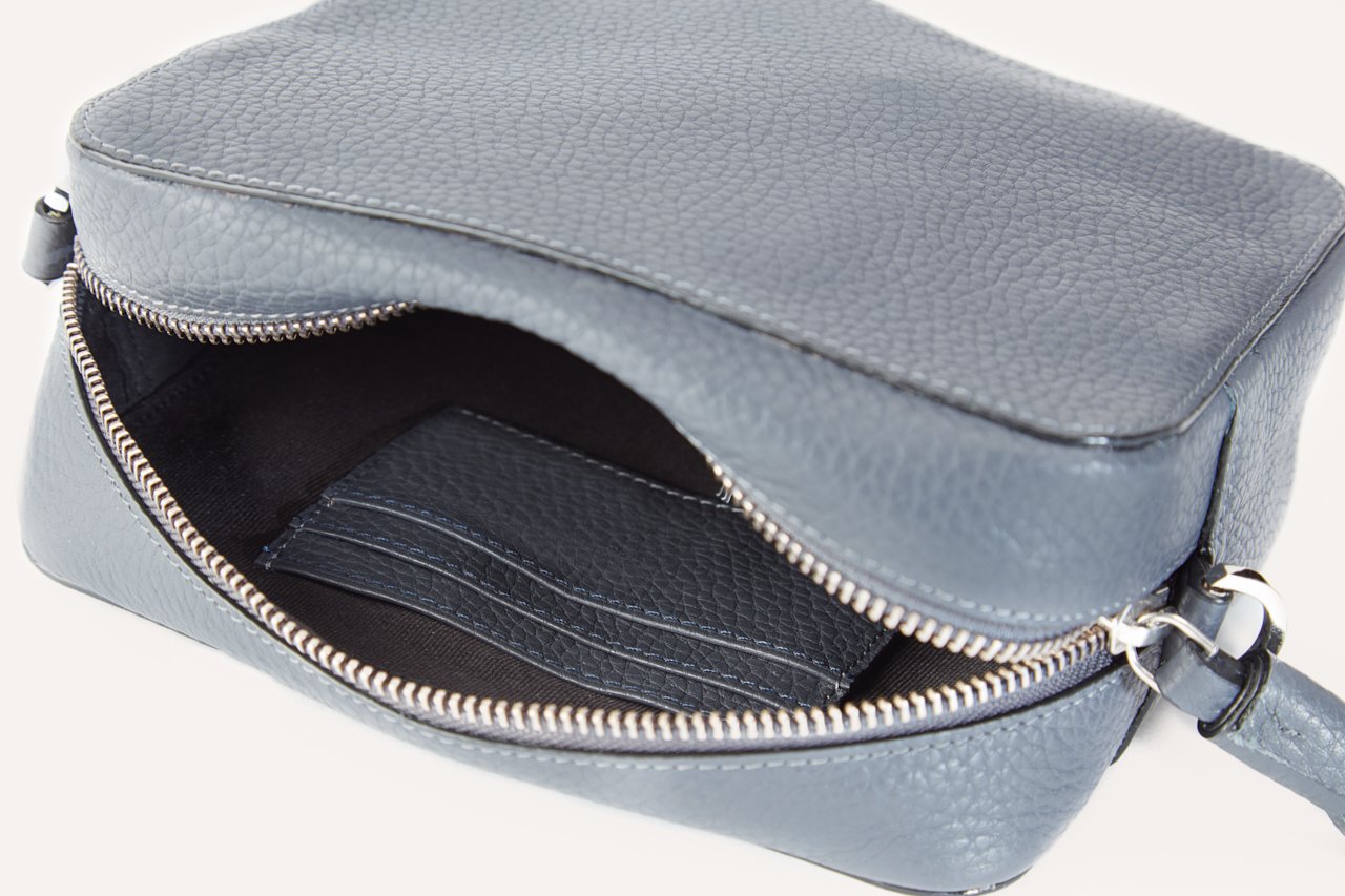 Loveable Crossbody bag made from genuine pebble leather, featuring an adjustable strap and internal card slots.