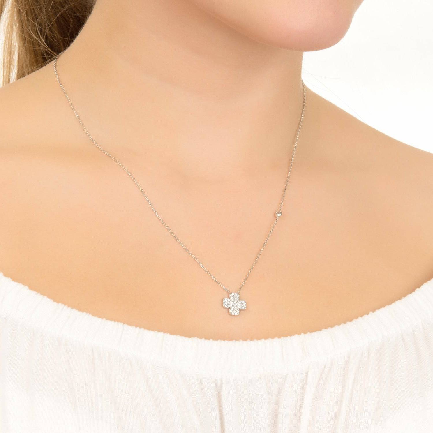 A delicate Lucky Four Leaf Clover Necklace made of 925 sterling silver with white zirconia, showcasing its elegant design and adjustable length.