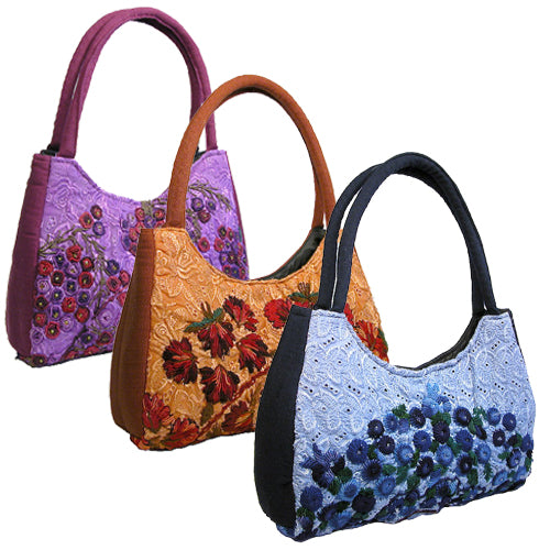 Luna Rococo Handbag made from recycled Huipils, showcasing vibrant colors and intricate designs, perfect for everyday use.