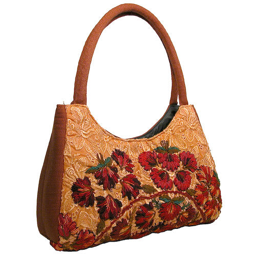 Luna Rococo Handbag made from recycled Huipils, showcasing vibrant colors and intricate designs, perfect for everyday use.