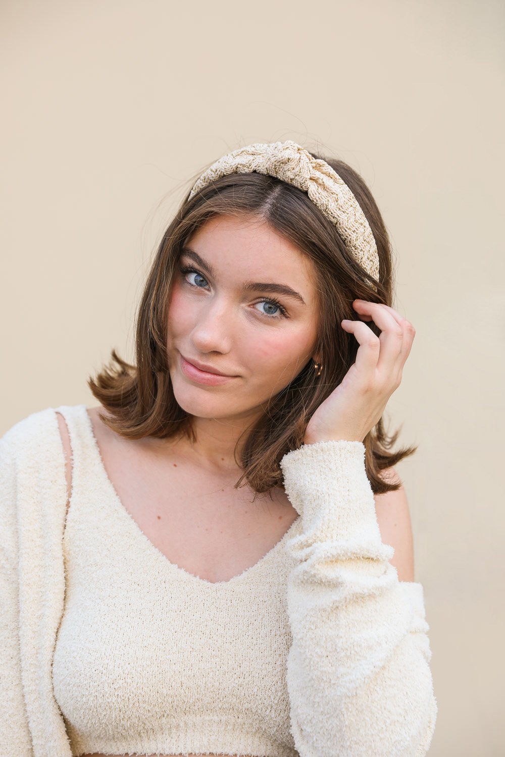 Lurex Basketwoven Top Knot Headband featuring a stylish top knot design and elegant basketwoven texture, made from 100% polyester.