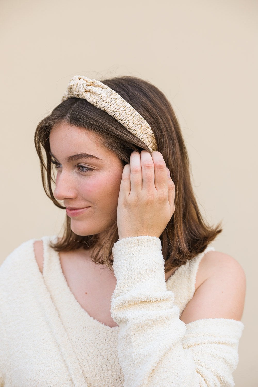 Lurex Basketwoven Top Knot Headband featuring a stylish top knot design and elegant basketwoven texture, made from 100% polyester.