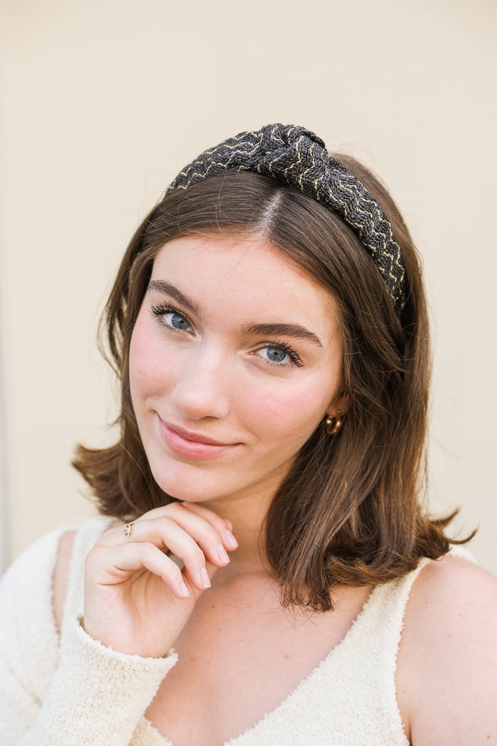 Lurex Basketwoven Top Knot Headband featuring a stylish top knot design and elegant basketwoven texture, made from 100% polyester.