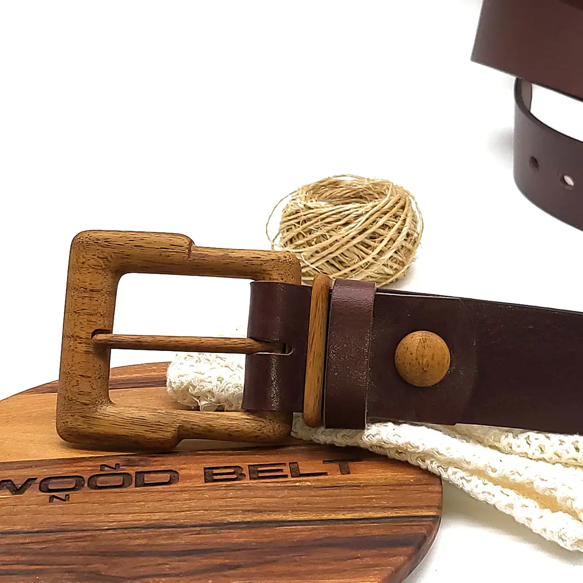 Wooden belt buckle with leather strap.