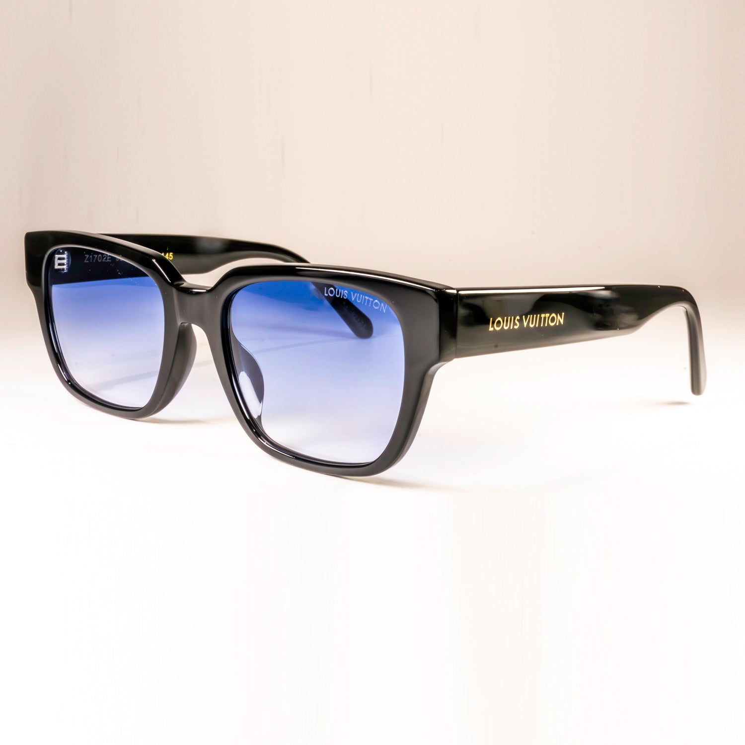 Stylish LV Street Sunglasses featuring a black acetate frame, black lenses, and gold-colour hardware with iconic Louis Vuitton design elements.