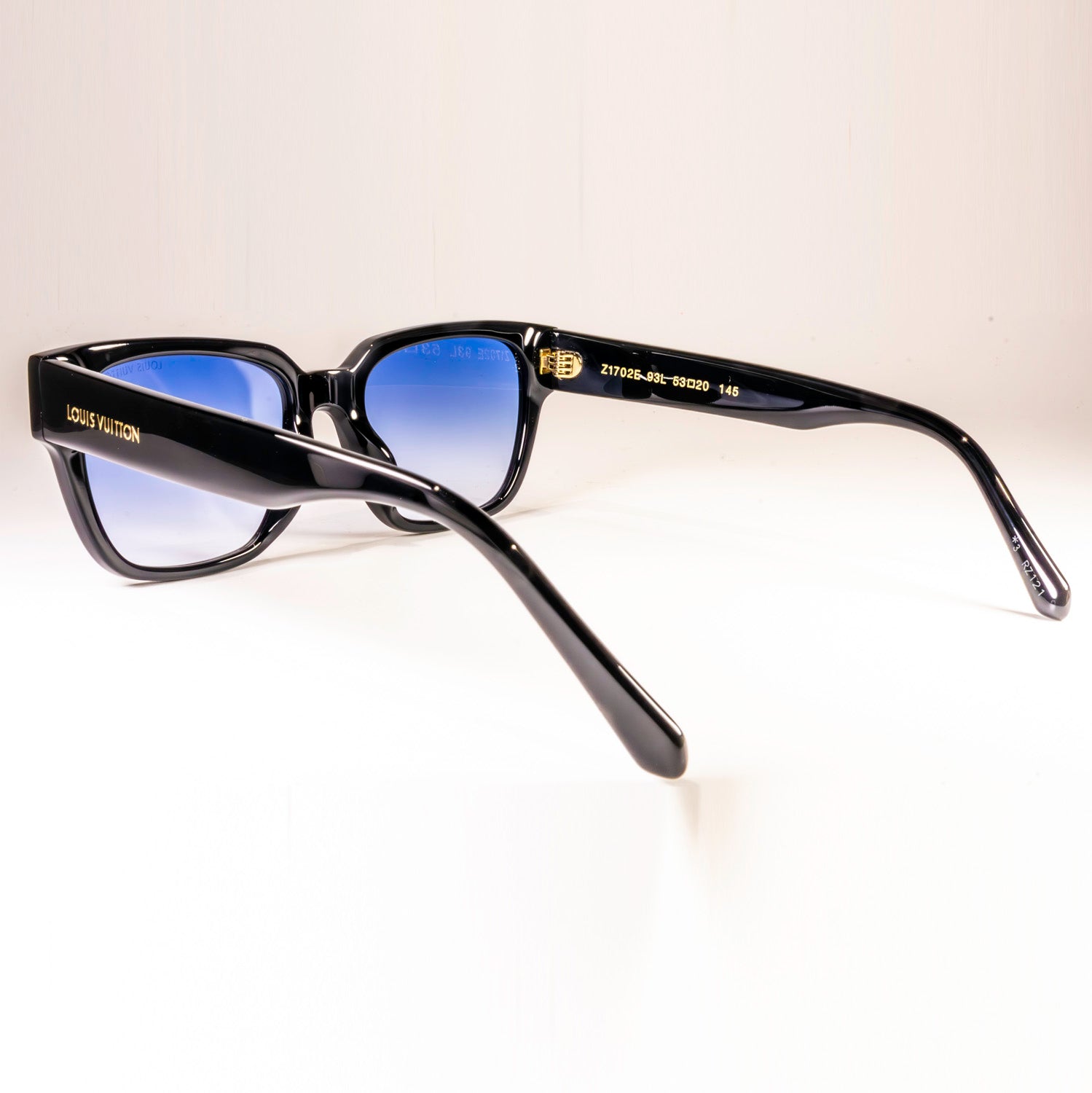 Stylish LV Street Sunglasses featuring a black acetate frame, black lenses, and gold-colour hardware with iconic Louis Vuitton design elements.