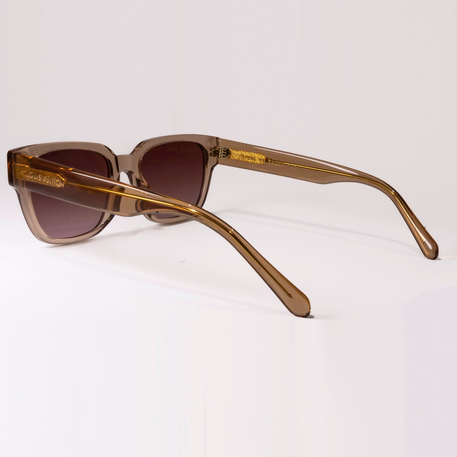 Stylish LV Street Sunglasses featuring a black acetate frame, black lenses, and gold-colour hardware with iconic Louis Vuitton design elements.