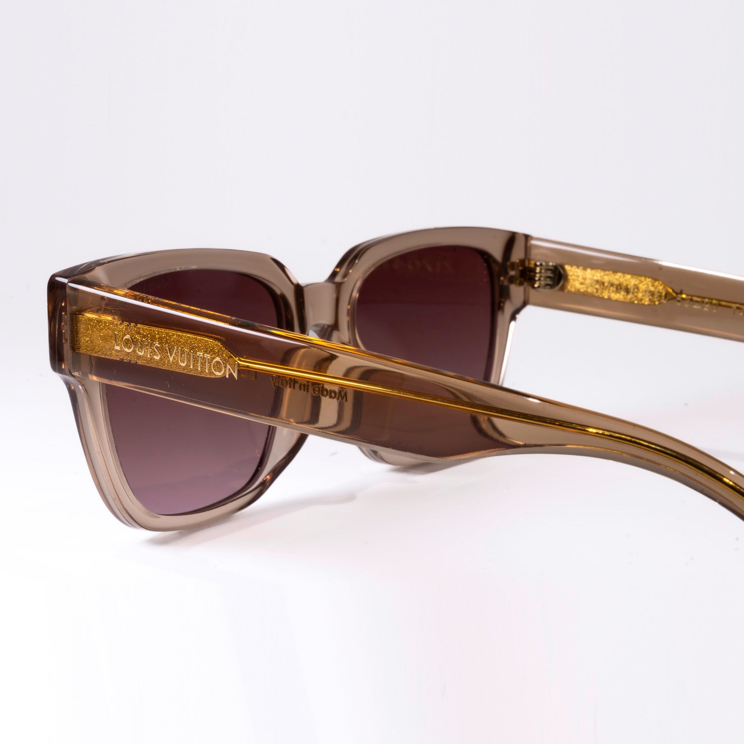 Stylish LV Street Sunglasses featuring a black acetate frame, black lenses, and gold-colour hardware with iconic Louis Vuitton design elements.