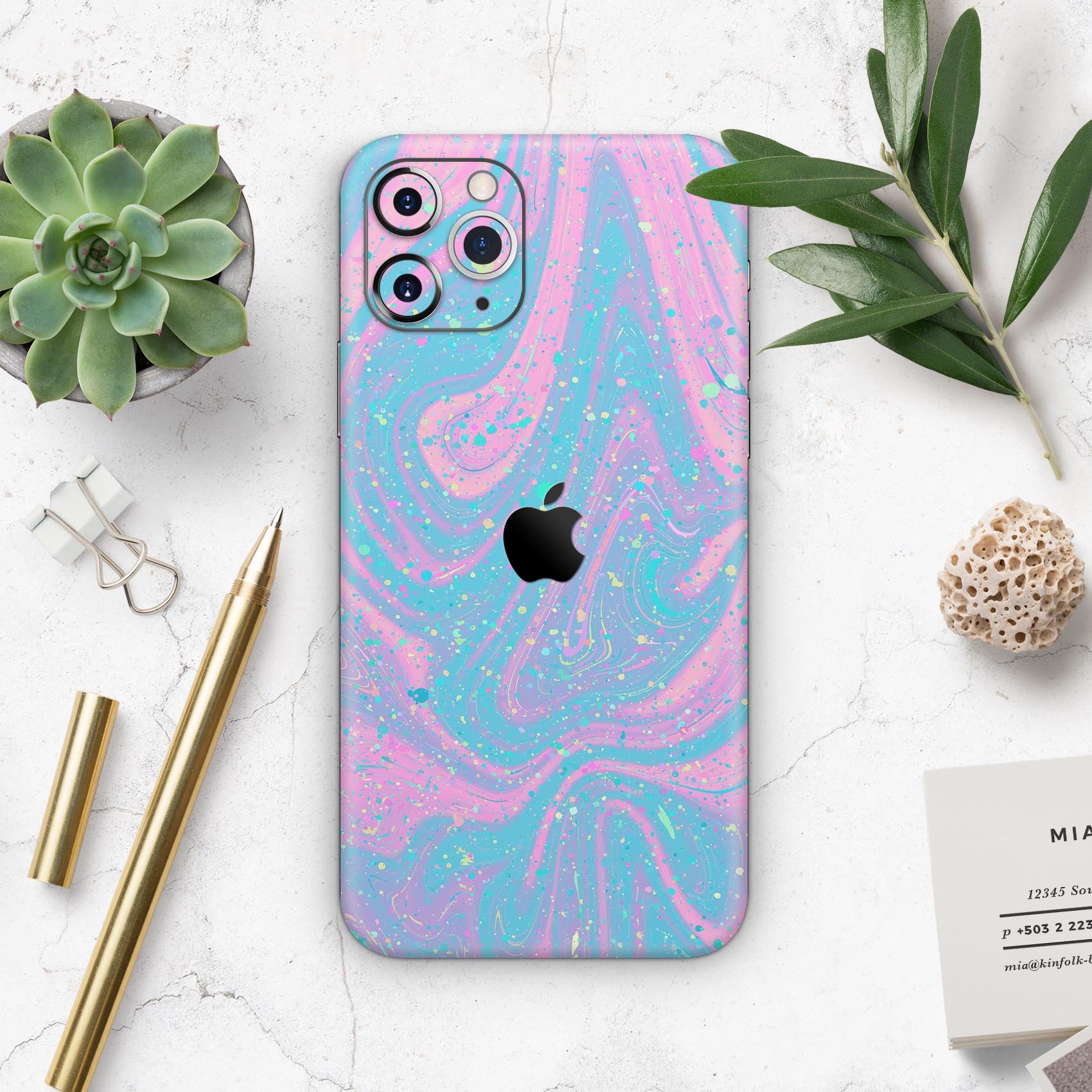 Magical Marble Skin-Kit for Apple iPhone 14 and 13, showcasing a stylish marble design on a sleek device.