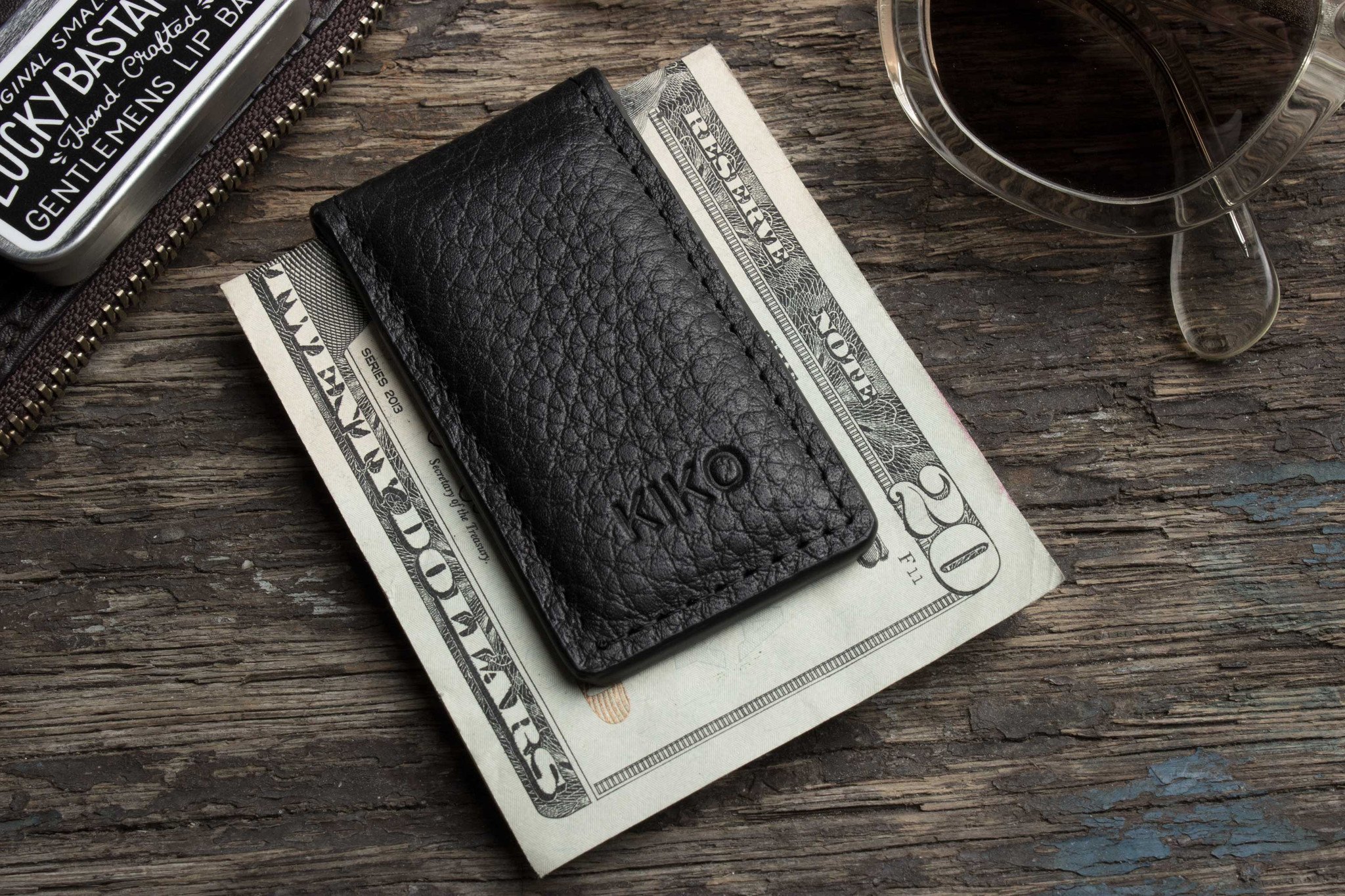 A stylish Magnetic Money Clip made from premium cowhide leather, featuring a compact design and heat burnished details.