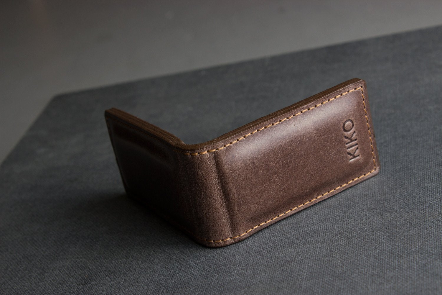 A stylish Magnetic Money Clip made from premium cowhide leather, featuring a compact design and heat burnished details.