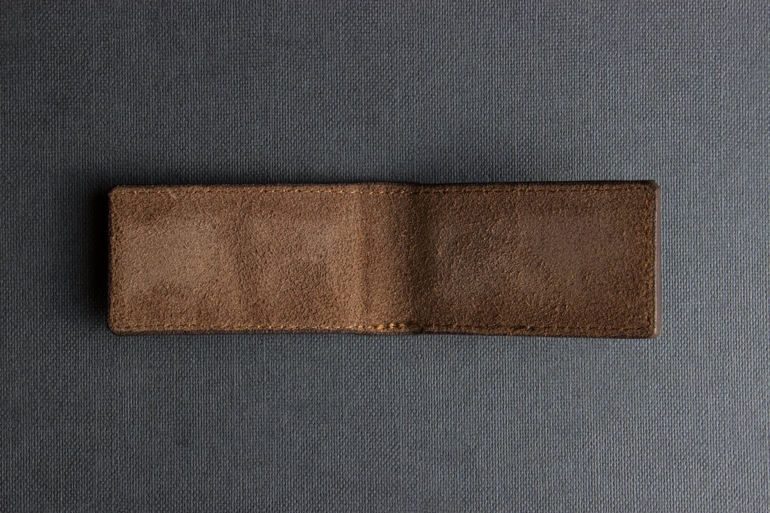 A stylish Magnetic Money Clip made from premium cowhide leather, featuring a compact design and heat burnished details.