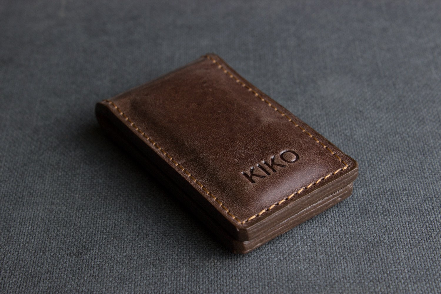 A stylish Magnetic Money Clip made from premium cowhide leather, featuring a compact design and heat burnished details.