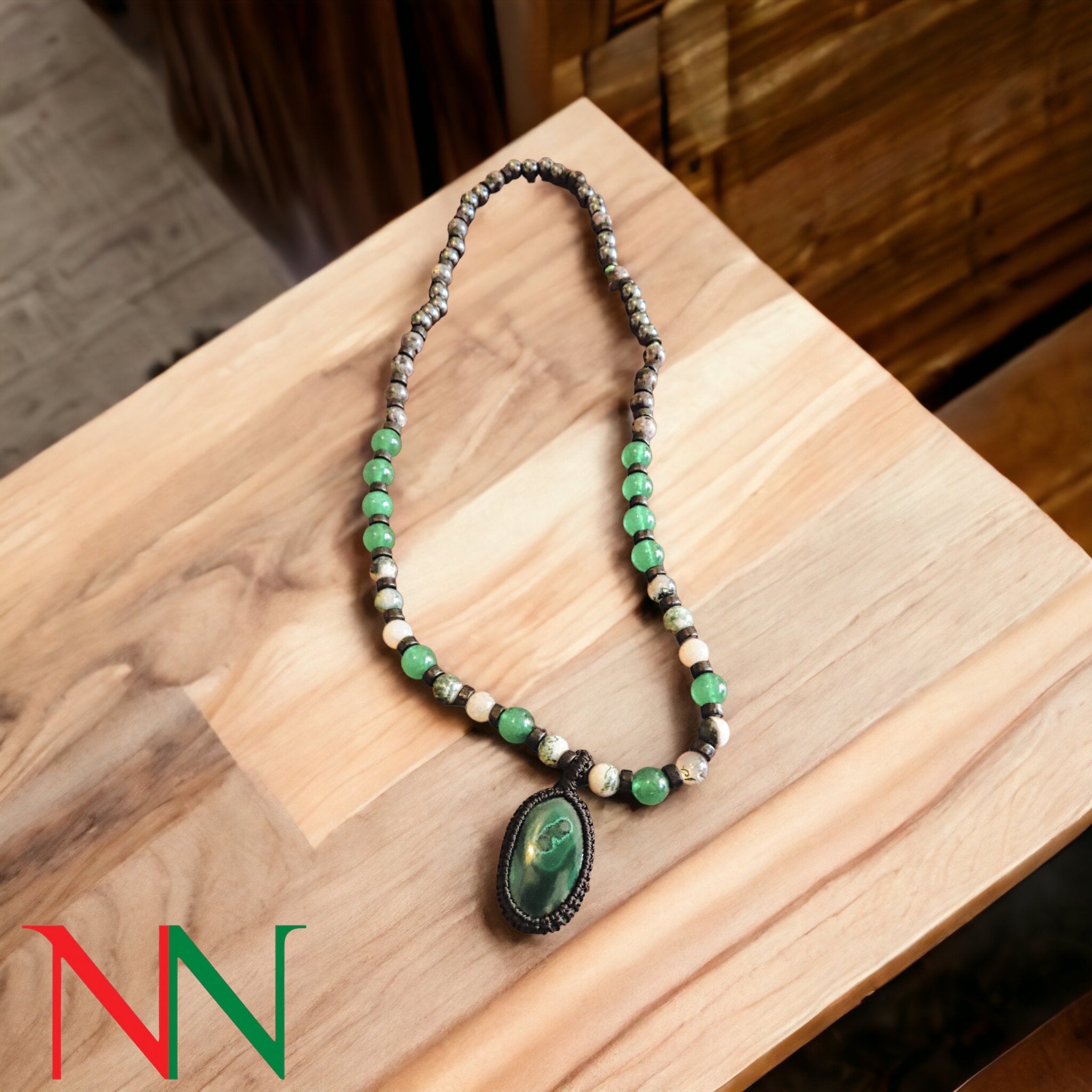 A stunning malachite necklace featuring vibrant green hues and unique banding, symbolizing peace and ancient Egyptian culture.