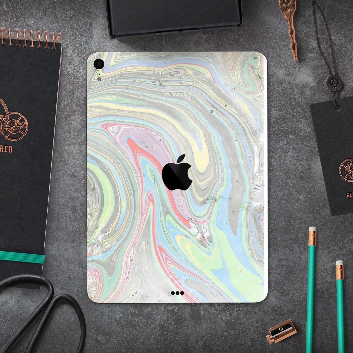 Marbleized Swirling Colors v2 skin decal for Apple devices, showcasing vibrant colors and a sleek design.