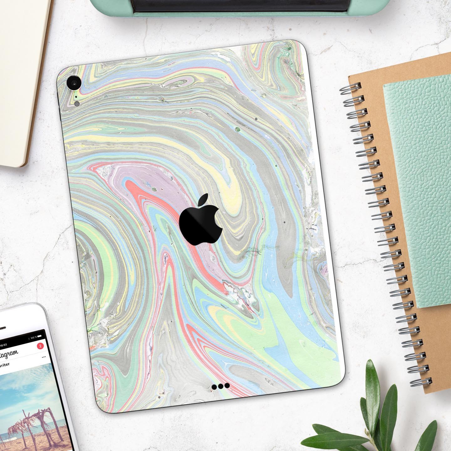 Marbleized Swirling Colors v2 skin decal for Apple devices, showcasing vibrant colors and a sleek design.