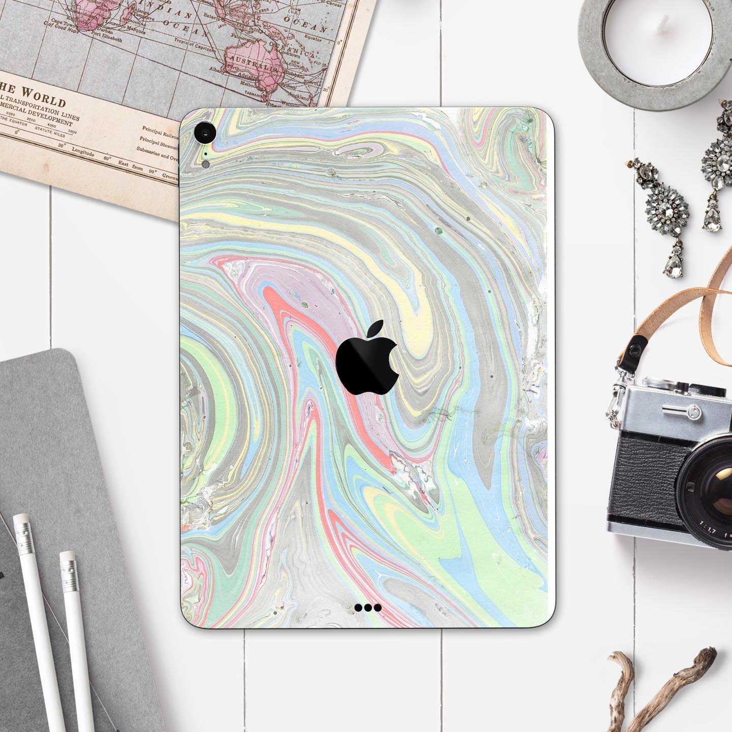 Marbleized Swirling Colors v2 skin decal for Apple devices, showcasing vibrant colors and a sleek design.