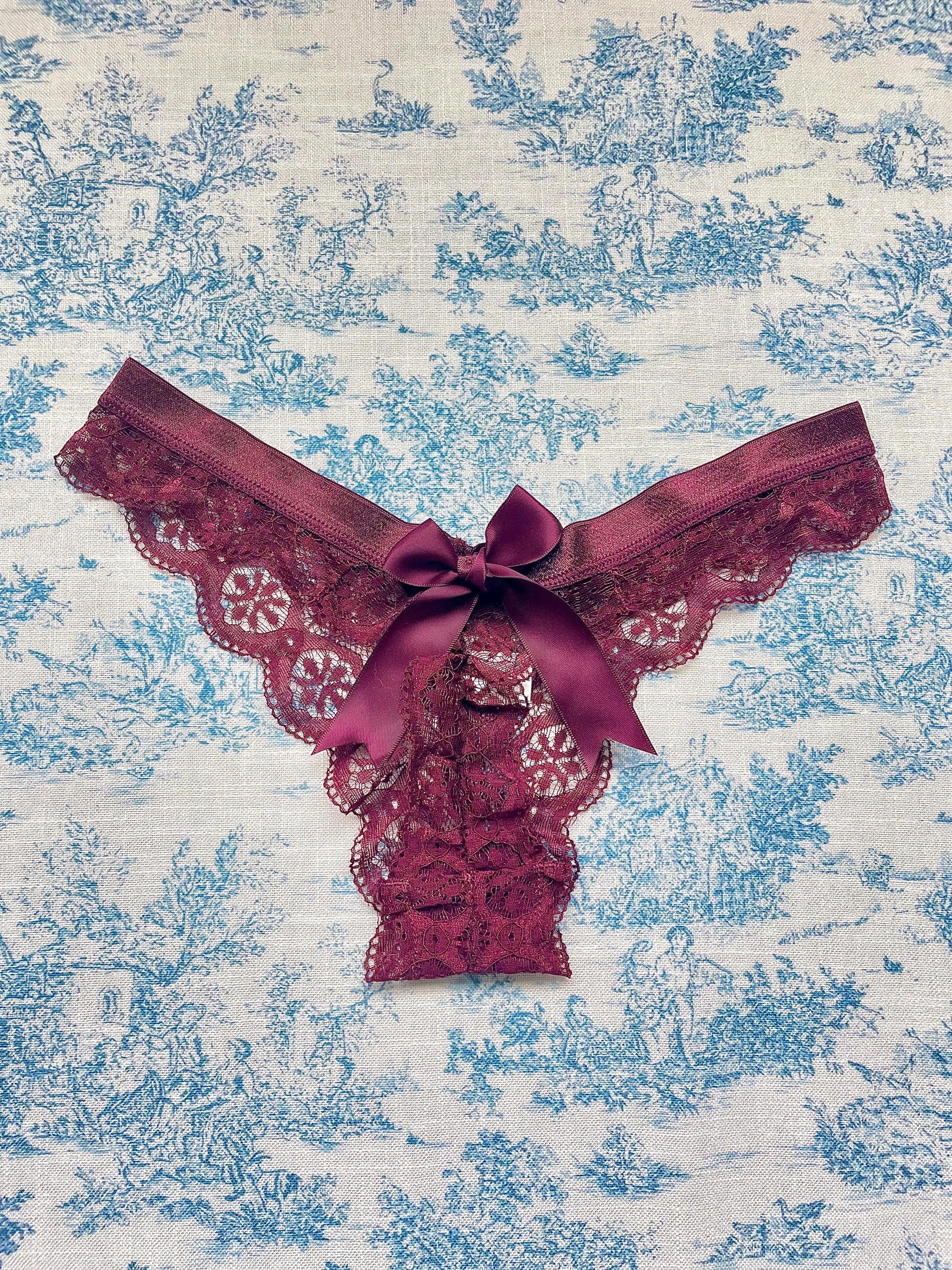 Maroon Lace Bow Panty featuring intricate lace design and satin bow detail, perfect for elegant lingerie collections.