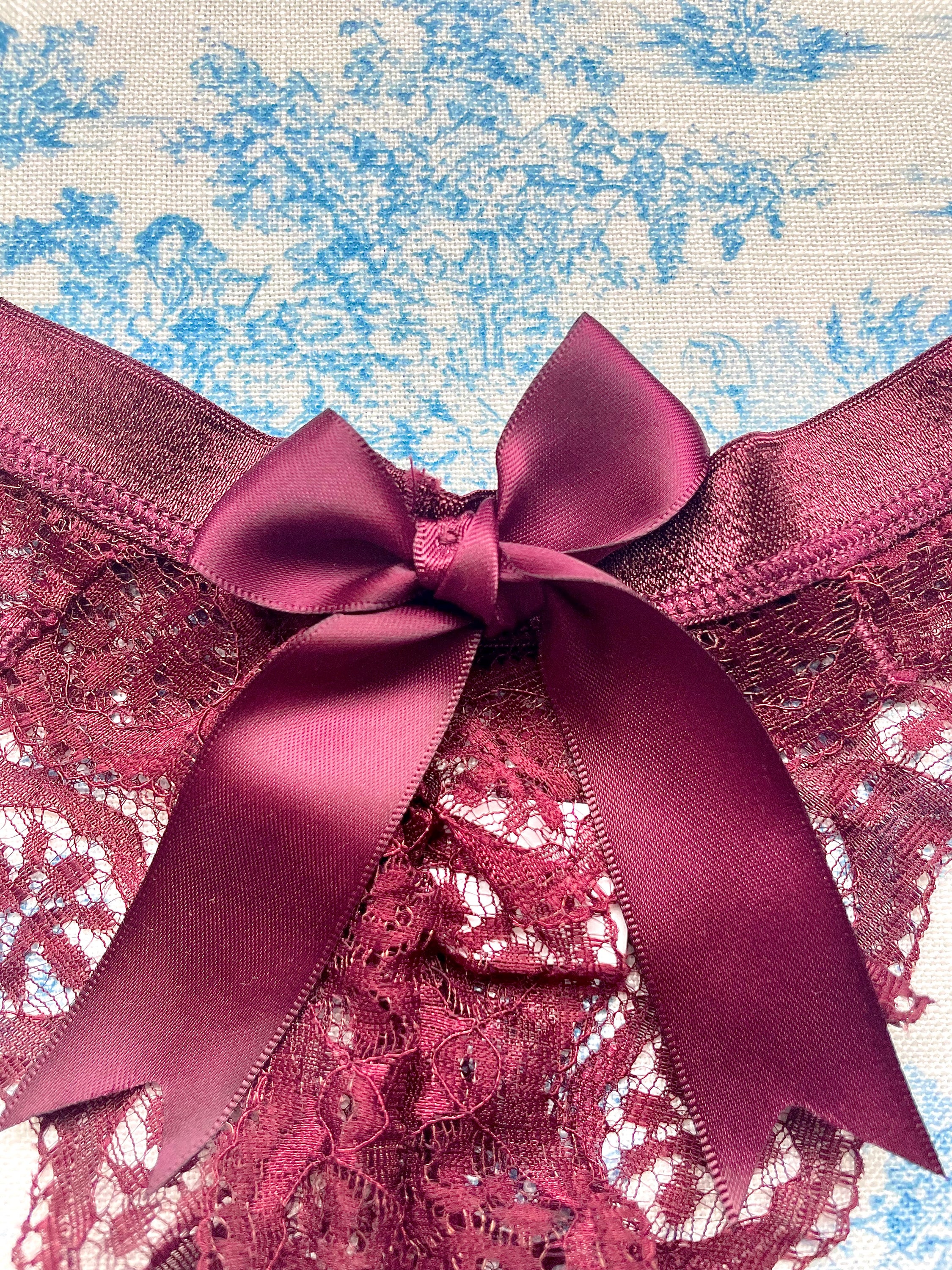 Maroon Lace Bow Panty featuring intricate lace design and satin bow detail, perfect for elegant lingerie collections.