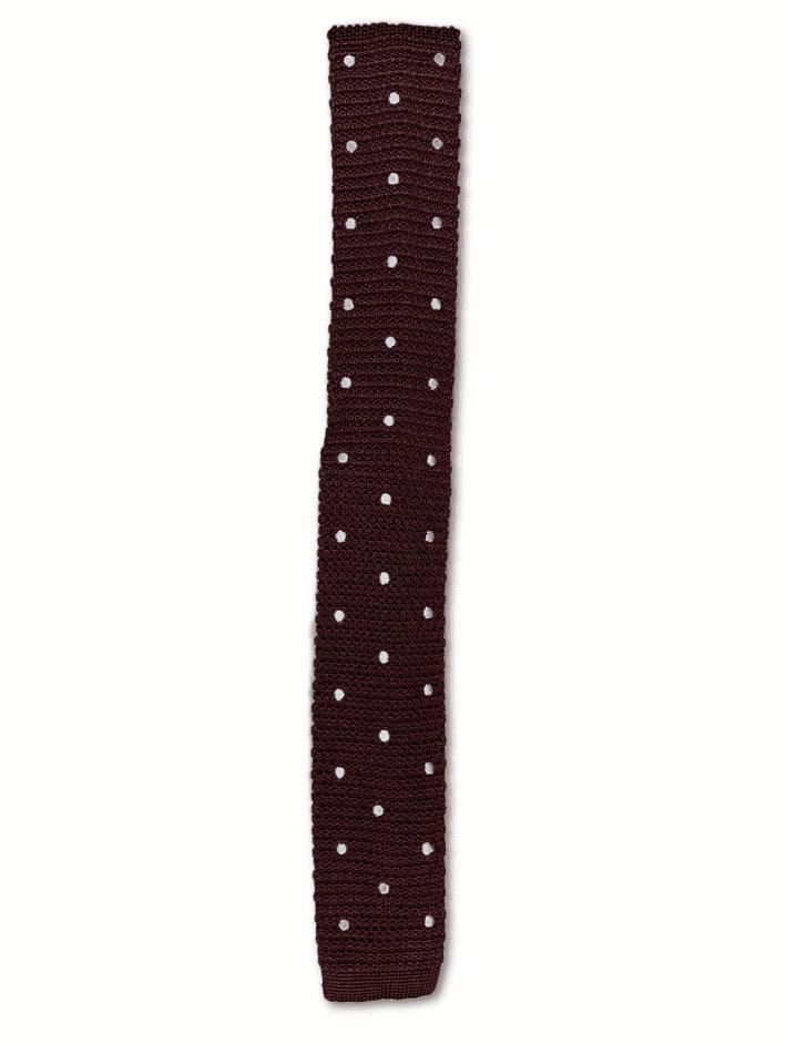 Maroon silk knitted tie with white polka dots, featuring a square end design and a width of 5.5cm.