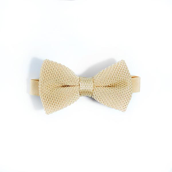 Mellow yellow knitted bow tie displayed on a white background, showcasing its vibrant color and textured design.