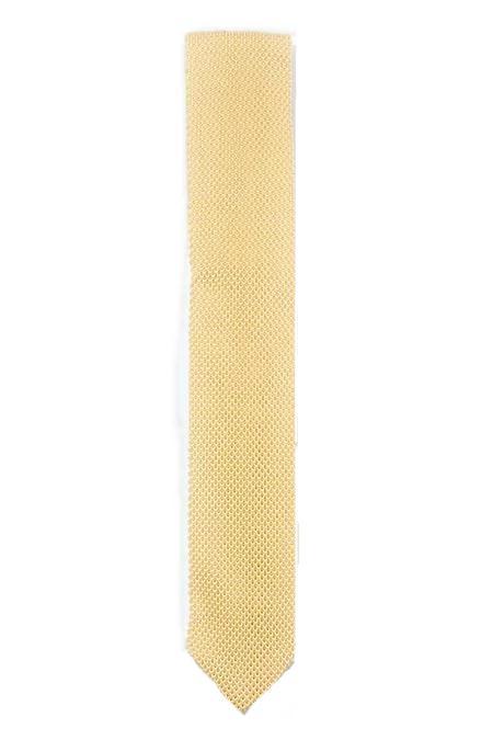 Mellow yellow knitted tie with a pointed end, showcasing its vibrant color and texture.